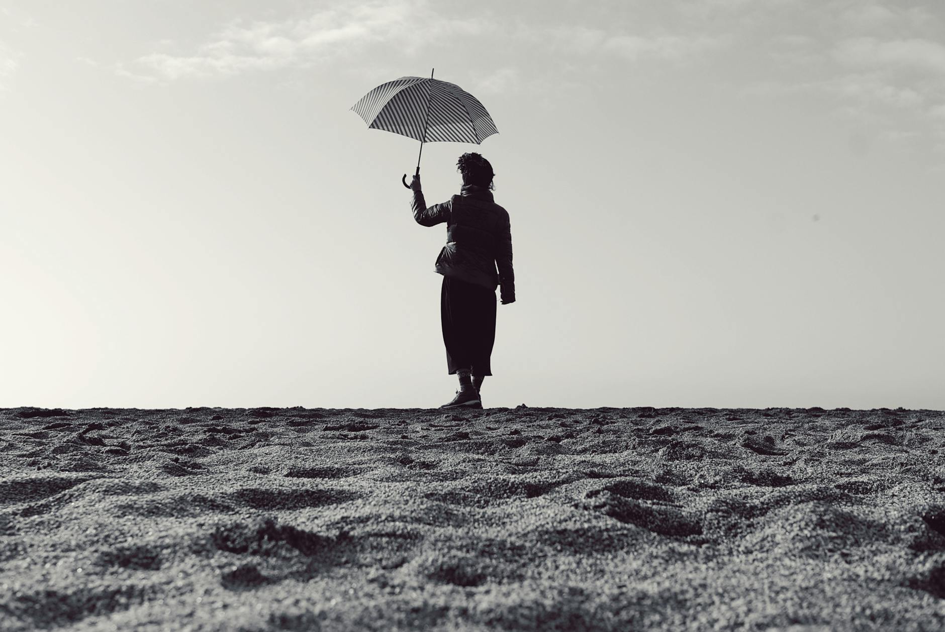 a woman holding an umbrella